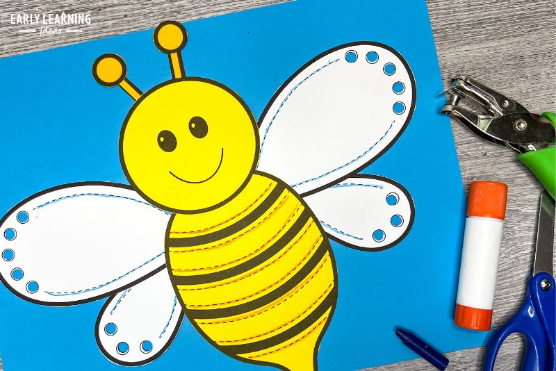 butterfly fine motor craft activity with glue stick and hole punch