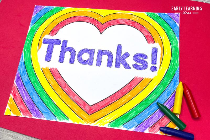 Heart coloring sheet customized with the word "thanks!" and colored in rainbow colors.