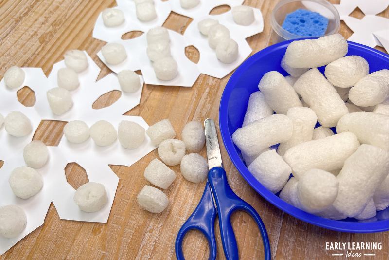 snow crafts - paper snowflakes with biodegradable packing peanuts