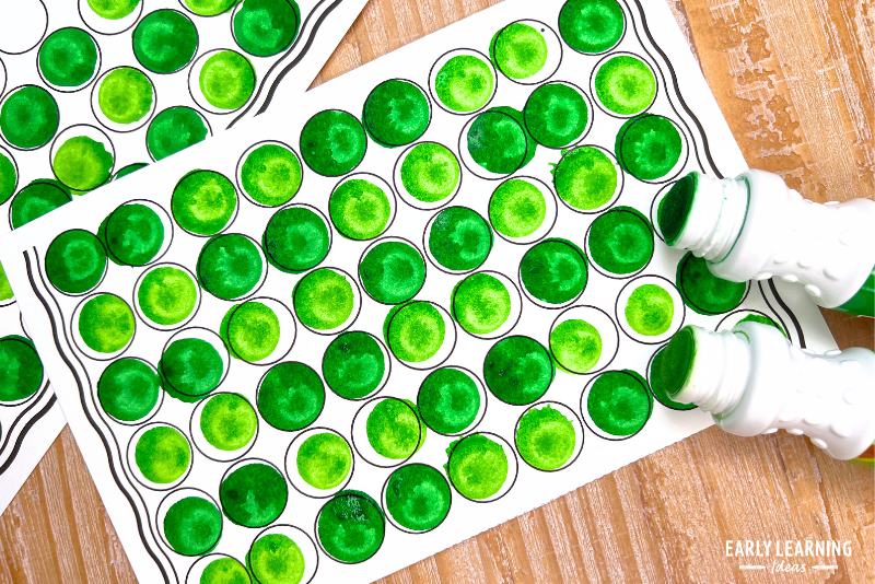 dot marker art pages with green dot markers - a fun St. Patrick's day art and craft activity and fine motor activity.