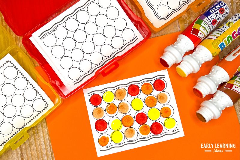 Dot marker art task boxes shown with red, orange, yellow, brown bingo daubers