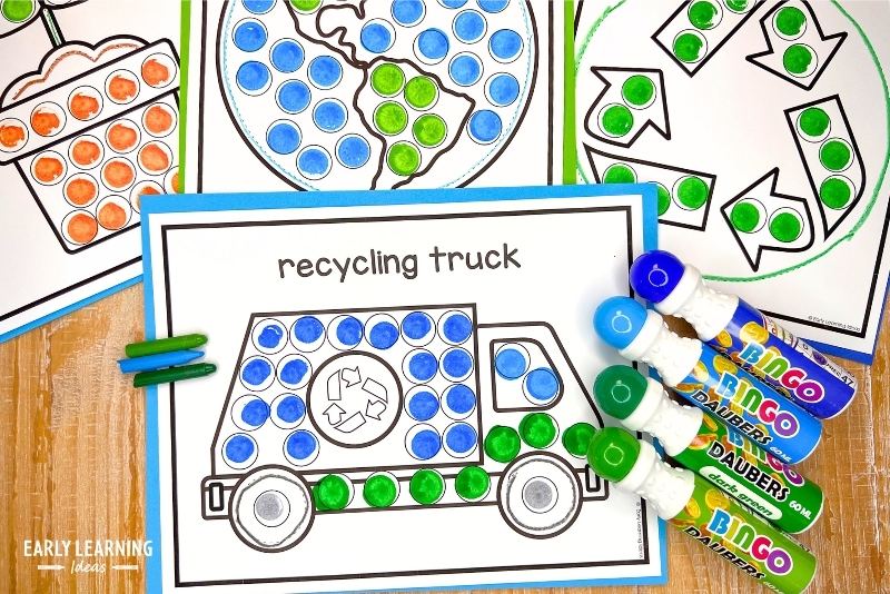 Earth Day dot marker painting pages. A recycling truck image is shown with a crayon and dot markers