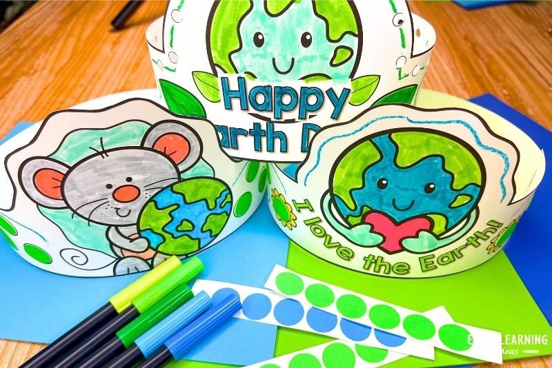 3 example of Earth Day headband crown crafts shown with markers and dot stickers