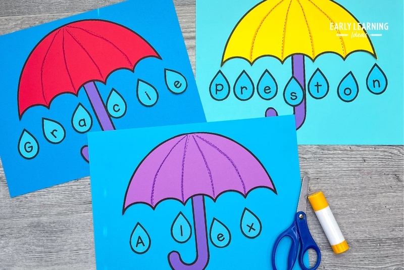 umbrella name crafts shown with scissors and glue stick