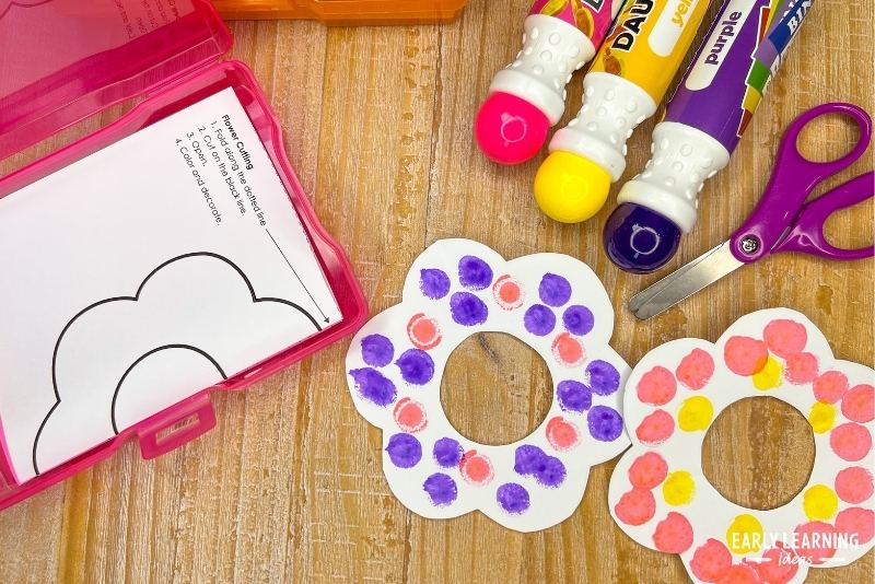 Fold and cut flower craft decorated with dot markers