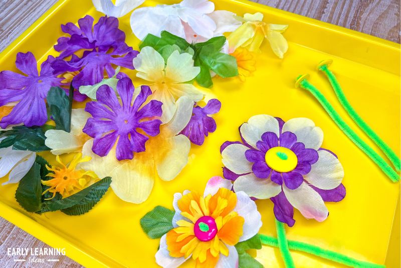 flower fine motor activity for preschoolers - silk flower pieces laced onto pipe cleaners