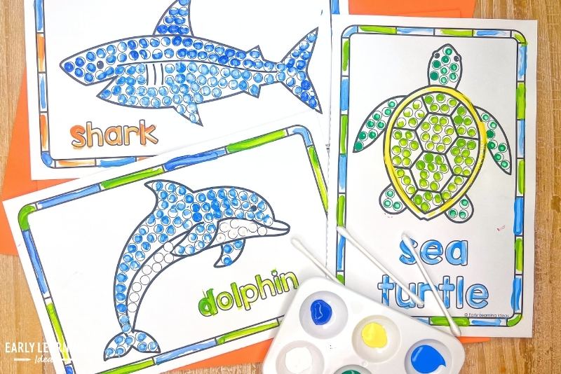 q-tip painting crafts - a shark, dolphin, and sea turtle craft shown with paint and q-tips