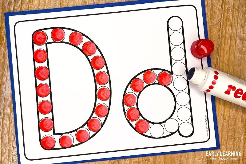 A letter d dot letter page shown with a red marker