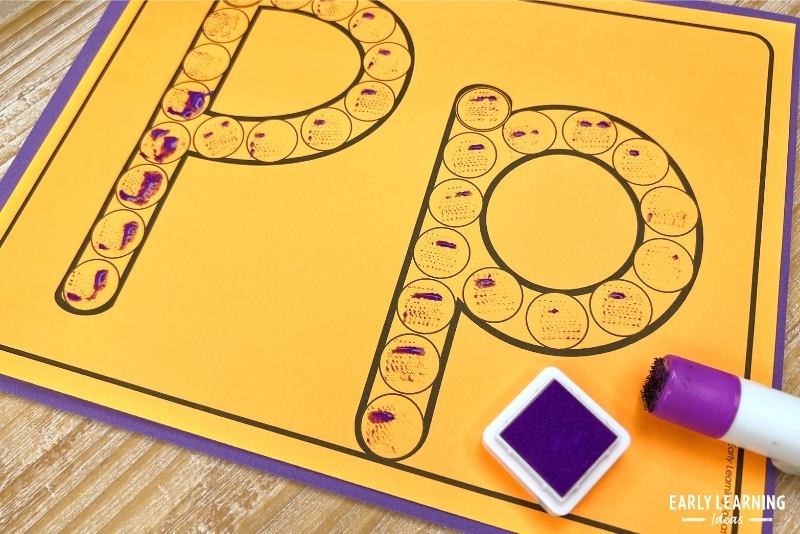 DIY stamp, a purple stamp pad on a letter p dot letter sheet.