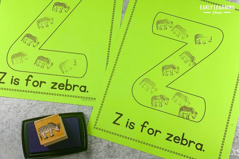 Letter z is for zebra alphabet activity.  A zebra stamp and stamp pad are shown with printable letter pages that have zebras stamped onto the large letter z on each page.