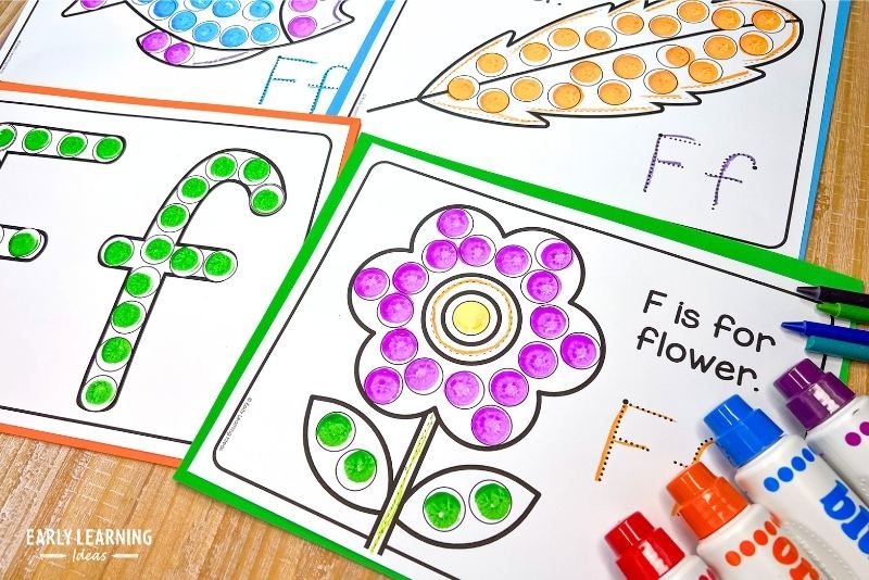 alphabet dot marker coloring sheets.  A flower and feather and letter f dot marker painting pages are shown.