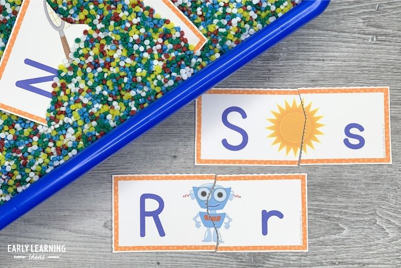 alphabet puzzles with a sensory bin