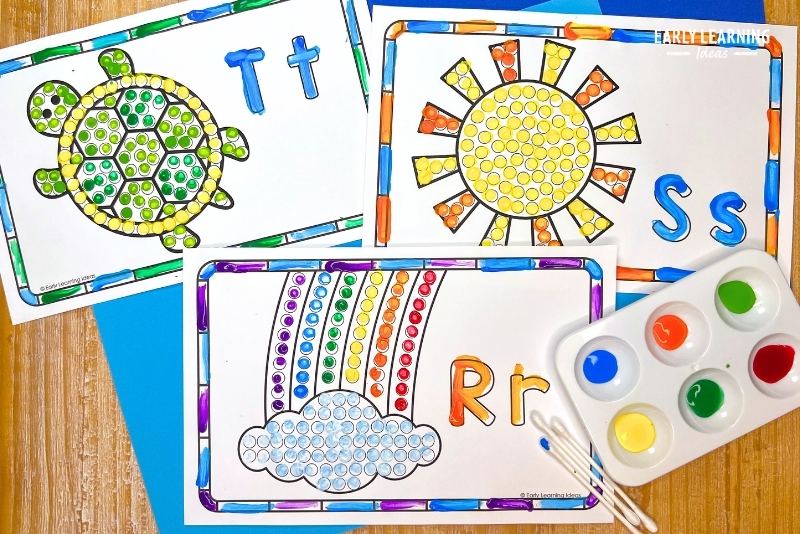 Alphabet q-tip painting activity - a rainbow, sun and turtle dot painting are shown with paint and q-tips