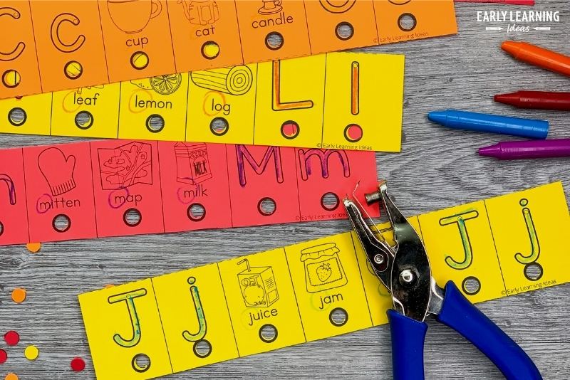 Letter J alphabet hole punch activity cards with crayons and a hole puncher