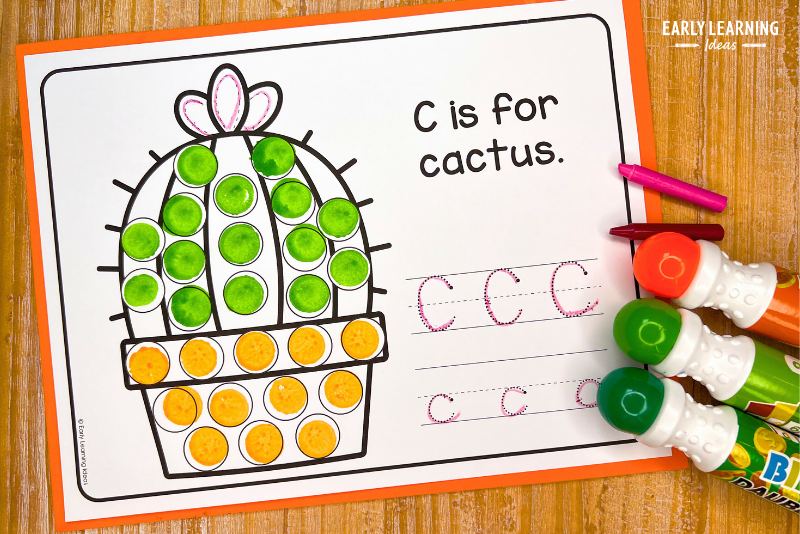 C is for cactus dot marker printable for preschoolers is shown with green and orange dot markers and crayons