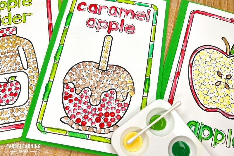 caramel apple q-tip dot painting printable shown with a paint tray and q-tips. Apple Day activity.