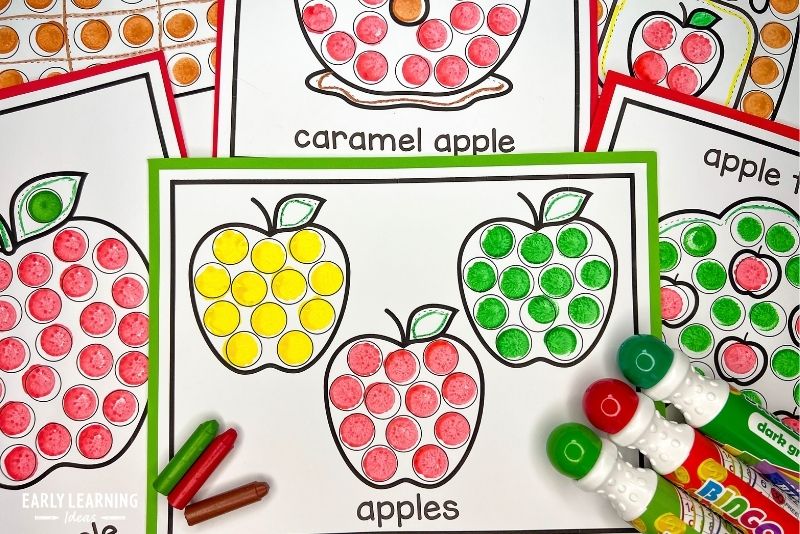 apple dot marker activities shown with crayons and dot markers. A fun Apple Day activity for kids.