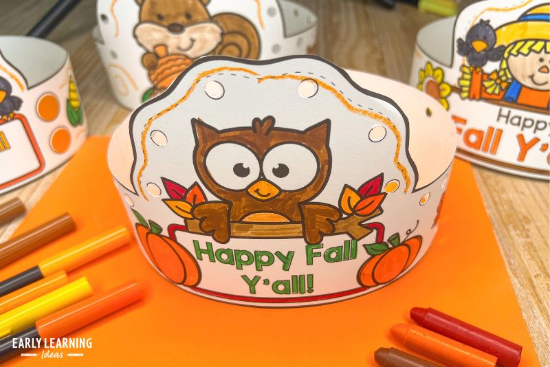 Happy Fall Y'all owl crown craft for preschool decorated with hole punches.