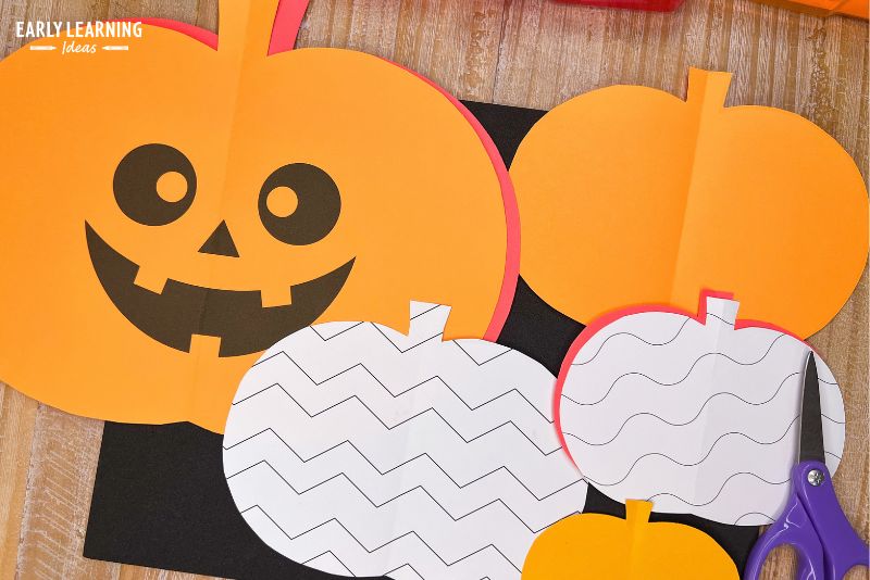 fold and cut pumpkin with lines, patterns or jack-o-lantern faces